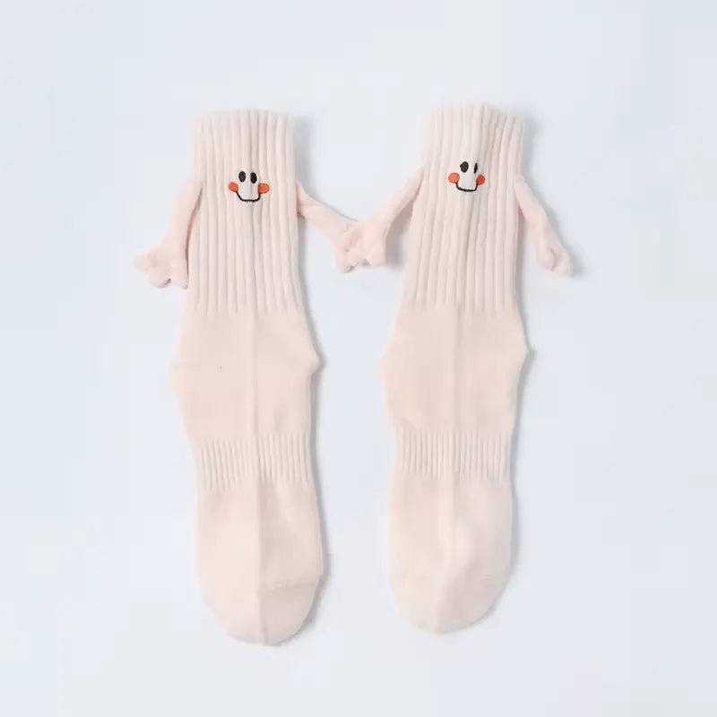 Chaussettes qui se tiennent la main