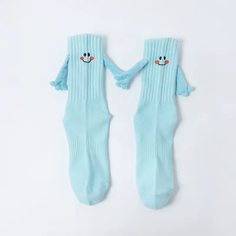 Chaussettes qui se tiennent la main