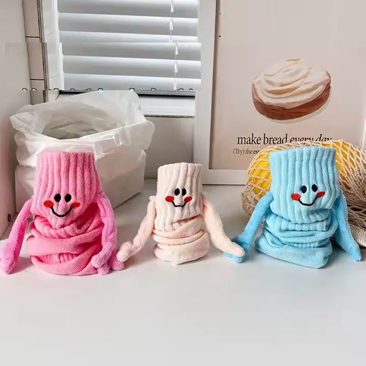 Chaussettes qui se tiennent la main